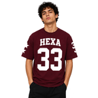 Hexa oversized baseball T-shirt in white with bold black lettering, relaxed fit style, front view showing the graphic design.
