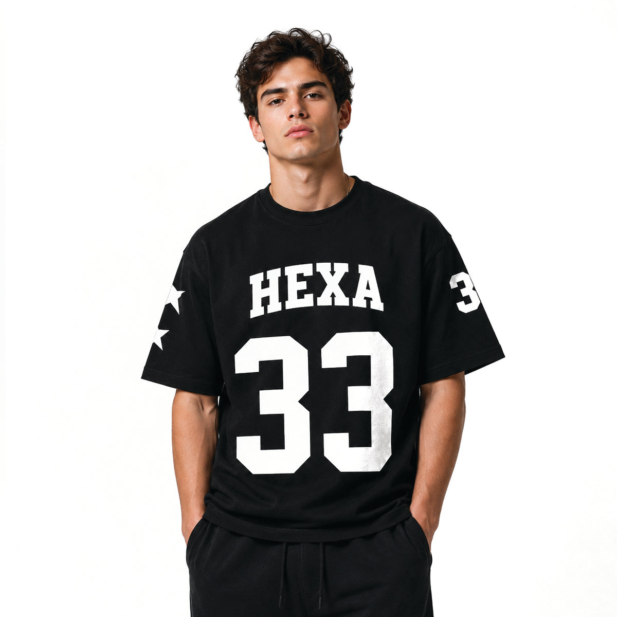Hexa oversized baseball T-shirt in white with bold black lettering, relaxed fit, and short sleeves shown on a plain background.